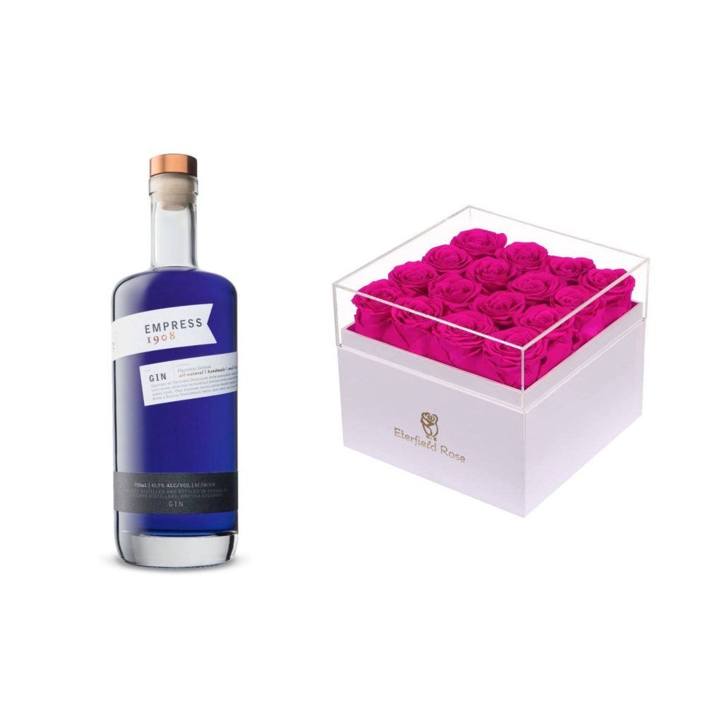 Empress 1908 Indigo Gin bottle with vibrant fuchsia Eterfield Roses in clear display box Wallpaper