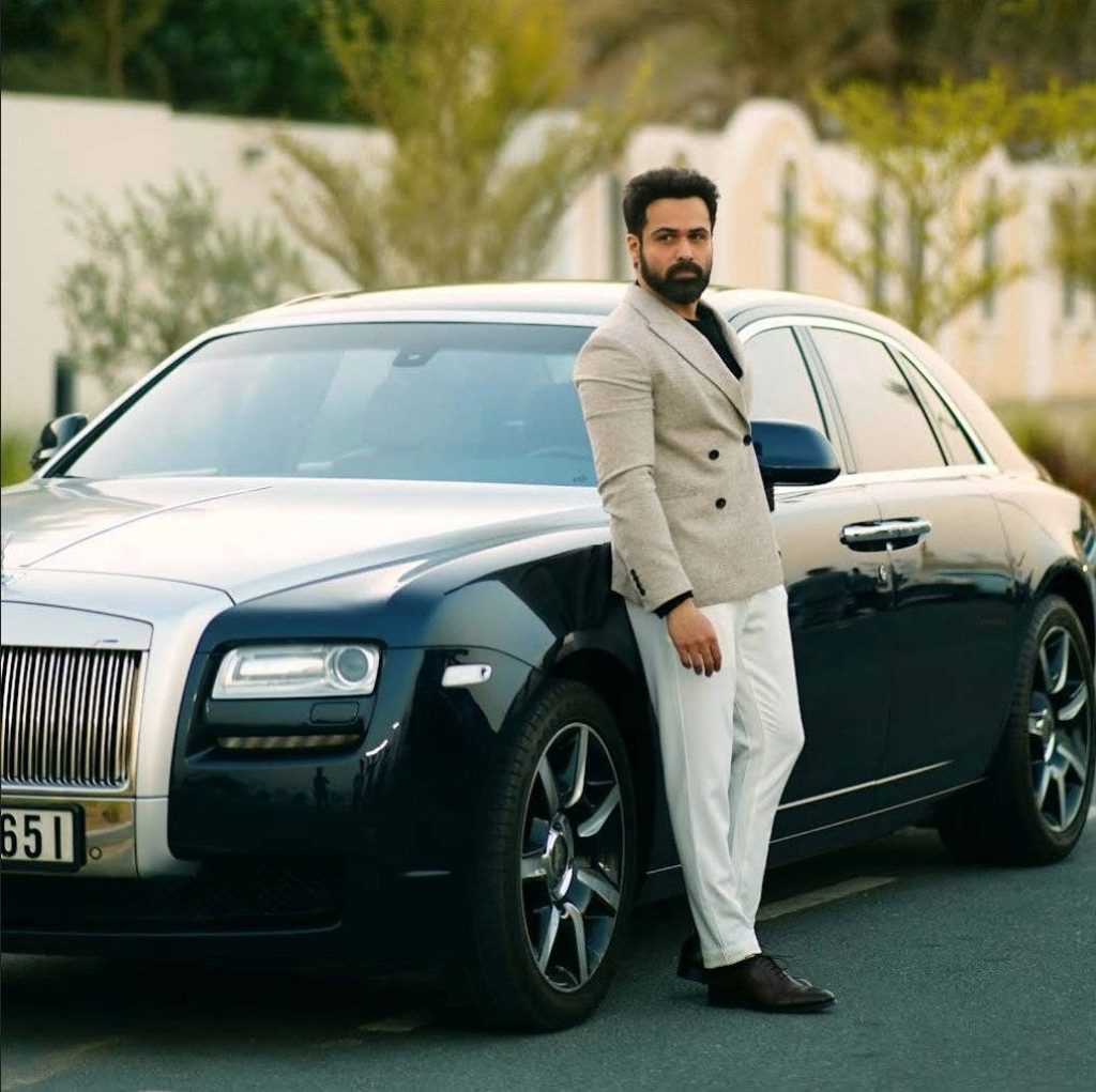 Emraan Hashmi stylish portrait with luxury Rolls-Royce wearing blazer and white trousers wallpaper