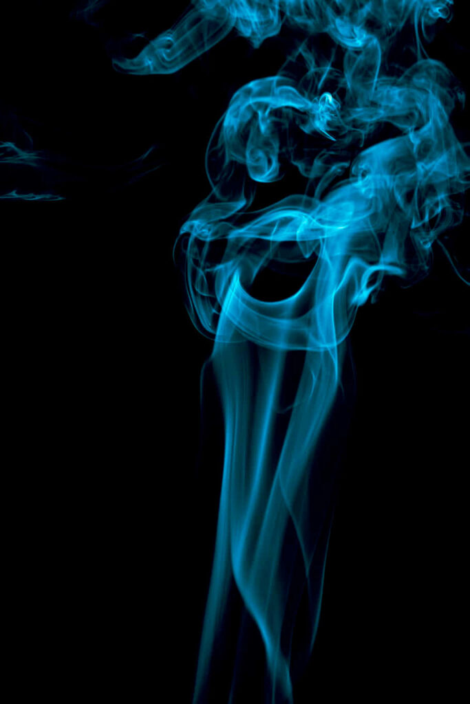 Mesmerizing Ethereal Blue Smoke Wallpaper on Black Background