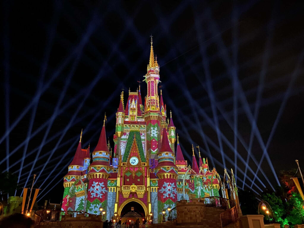 Enchanting Castle at Night: Colorful Projections & Magical Atmosphere Wallpaper