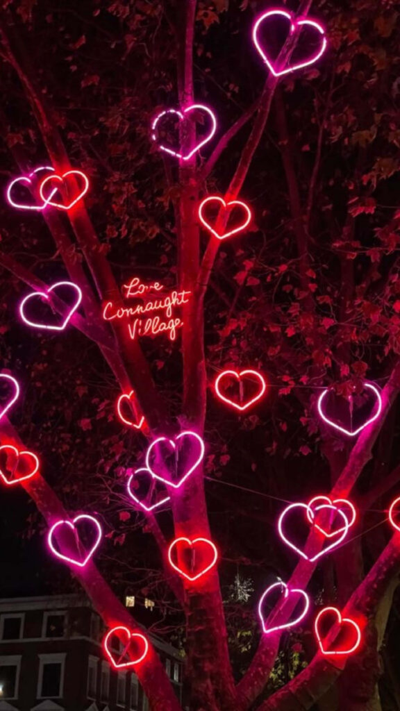 Enchanting Tree with Neon Heart Lights - Romantic Wallpaper Background