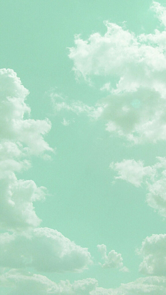 Dreamy Skies: Pastel Green Clouds Floating in a Whimsical Tumblr Aesthetic Wallpaper
