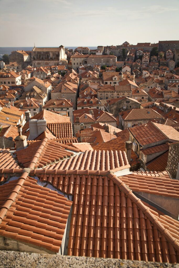 Charming Aerial Cityscape Wallpaper with Terracotta Rooftops