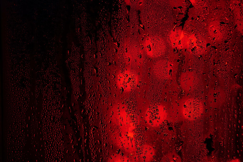 Rain-Drenched Window: Mesmerizing Black and Red 4K Wallpaper