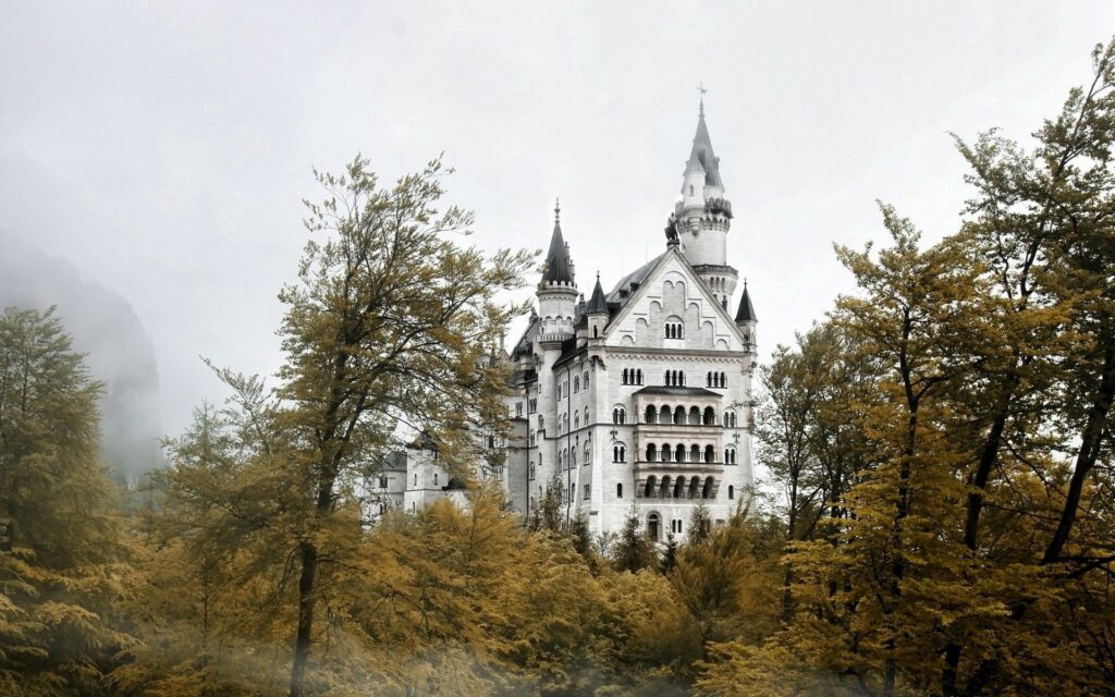 Enchanting Castle Wallpaper: Mystical Scene with Golden Trees