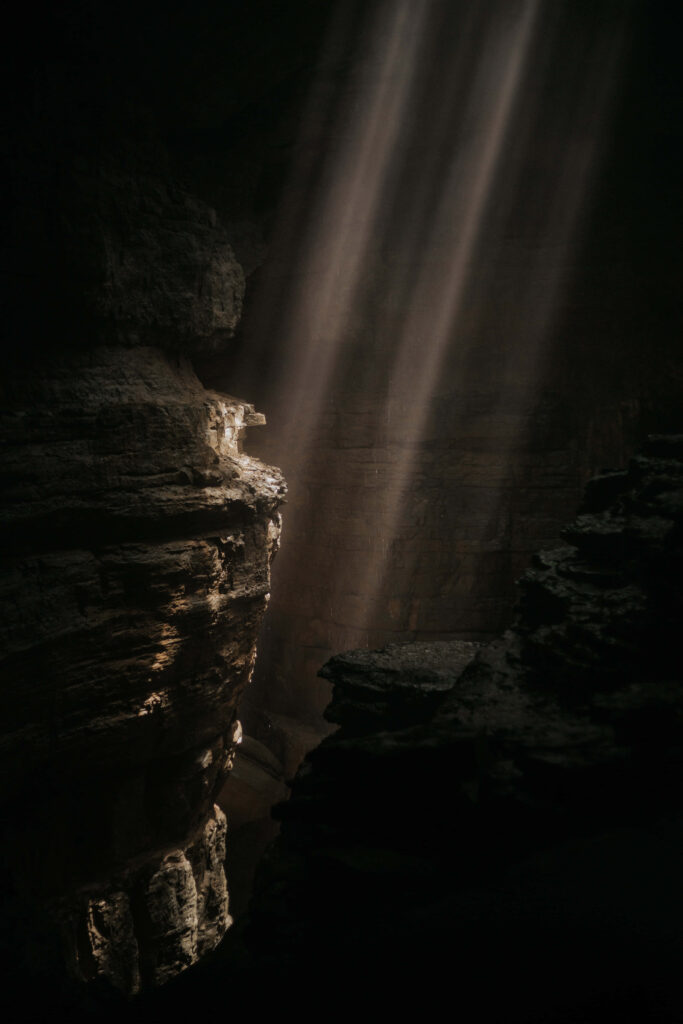 Mystical Cave Wallpaper: Sunlit Interior & Enchanting Atmosphere