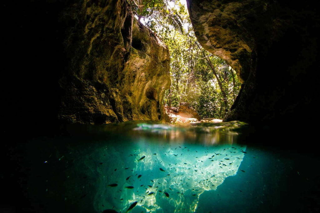 Enchanting Cave Wallpaper: Serene Nature Reflection Background