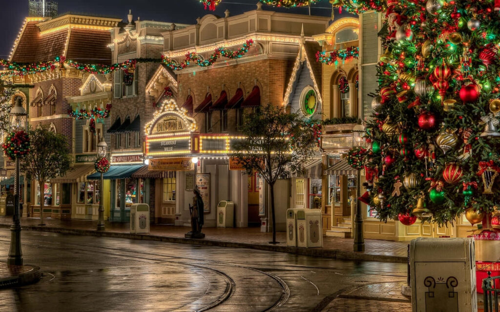 Enchanting Festive Street Scene with Colorful Christmas Lights Wallpaper