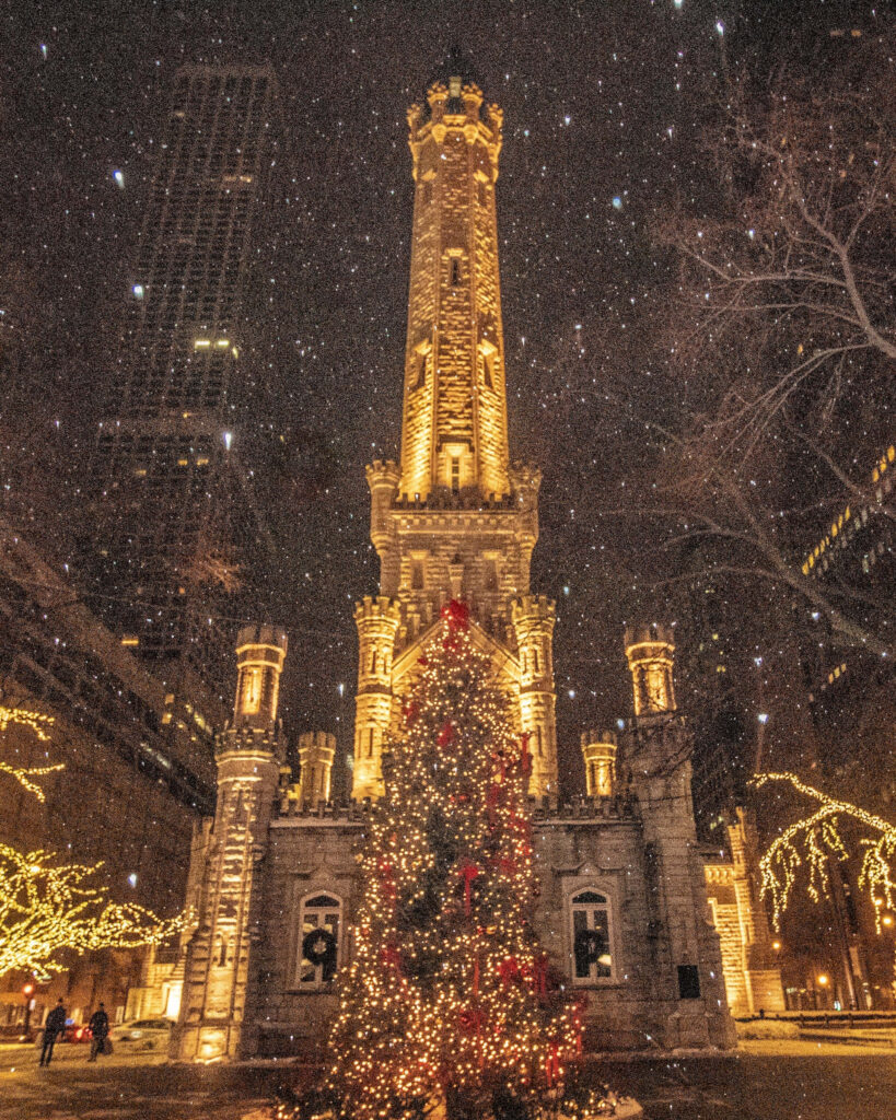 Historic Castle with Illuminated Christmas Tree and Snowy Atmosphere Wallpaper
