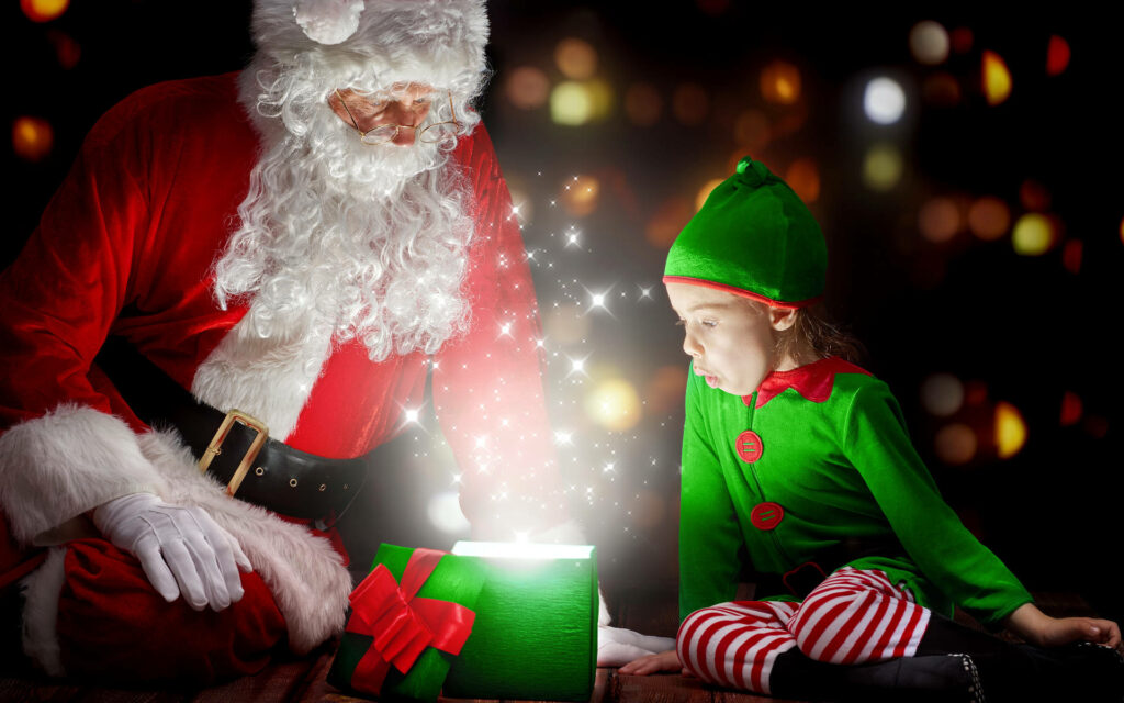 Enchanting Christmas Wallpaper: Santa & Elf Share a Magical Moment