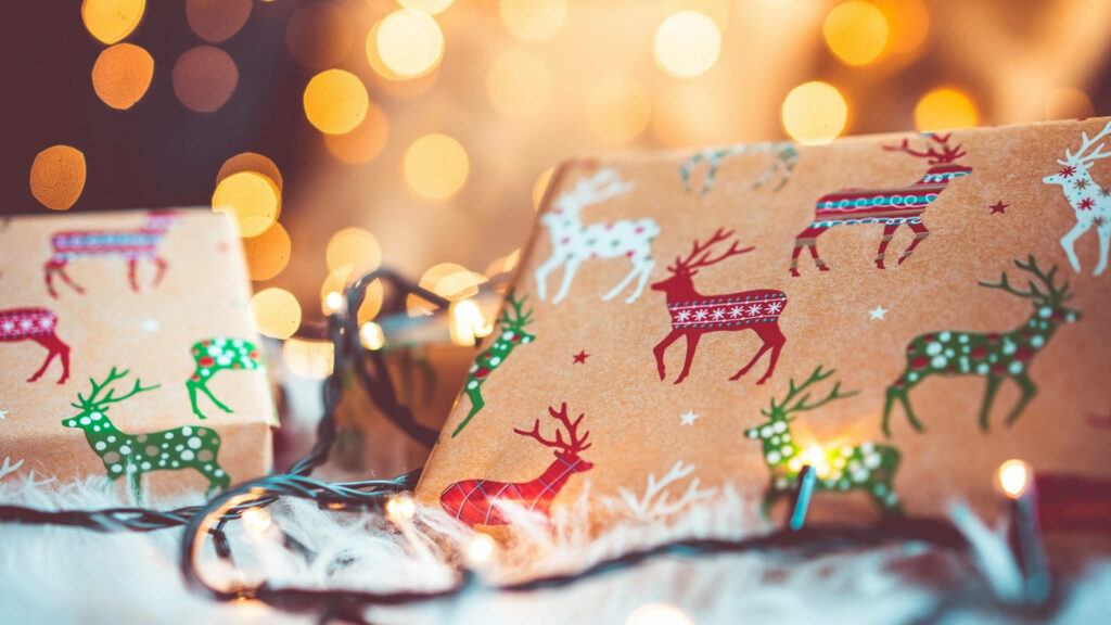 Christmas wallpaper with kraft paper gifts reindeer patterns glowing fairy lights cozy background