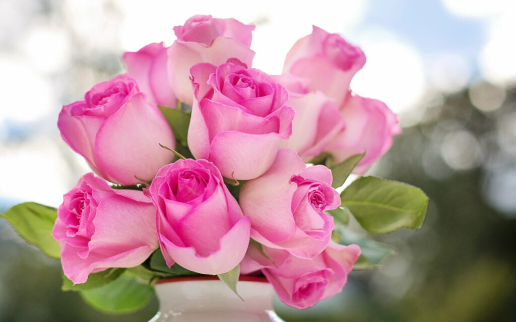 Blooming Elegance: Whispers of Pink Blossoms in a White Vase Wallpaper