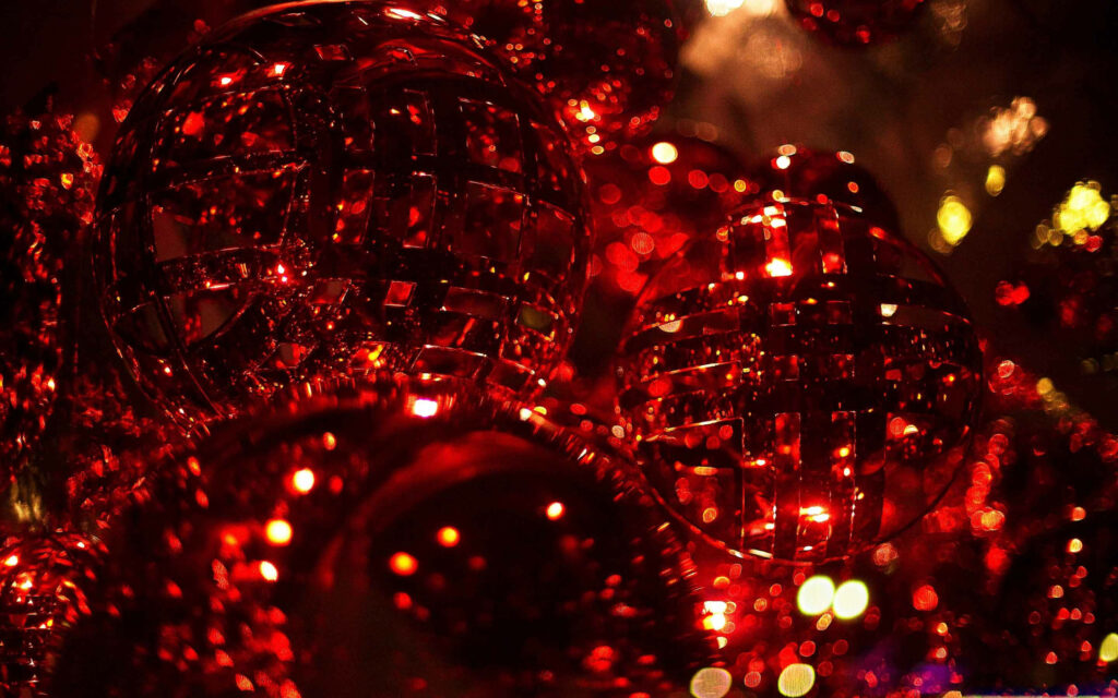 Mesmerizing Display: Radiant Red Crystals Gleam Amidst Festive Christmas Lights Wallpaper