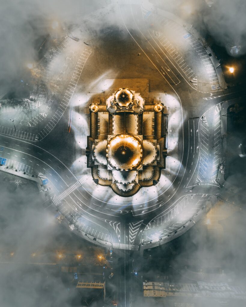 Enchanting Aerial Wallpaper: Illuminated Structure in Fog
