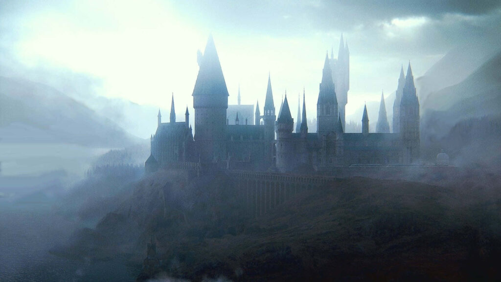 Enchanting Gothic Castle Wallpaper with Misty Hills and Water