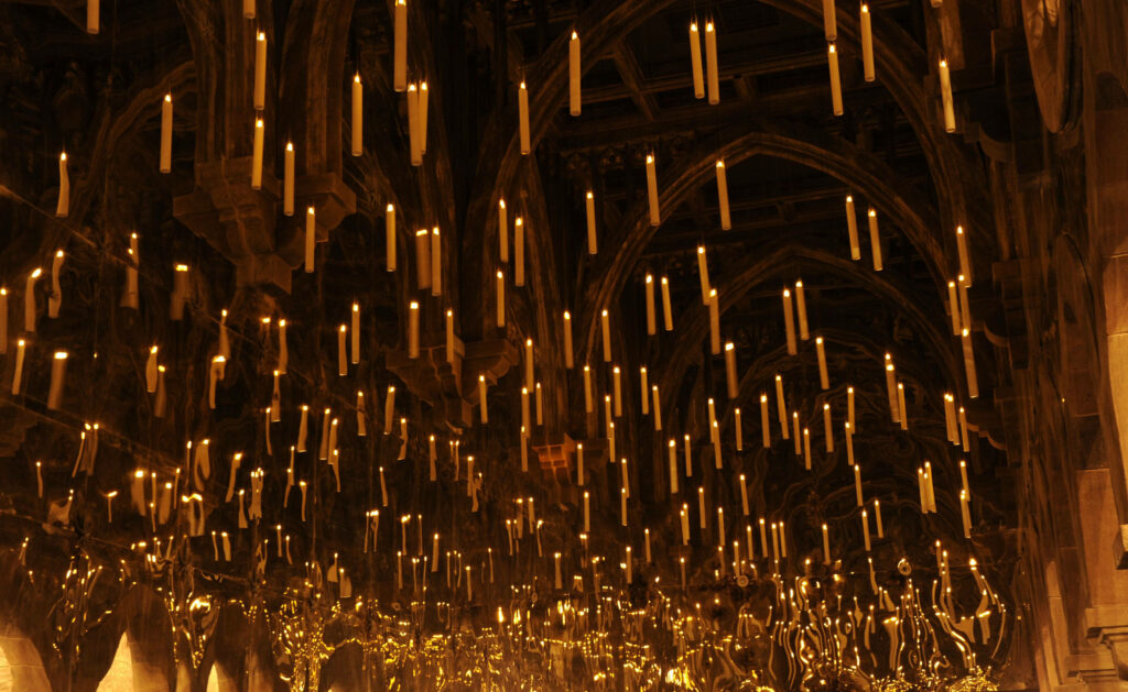 Enchanting Harry Potter Great Hall Wallpaper with Floating Candles