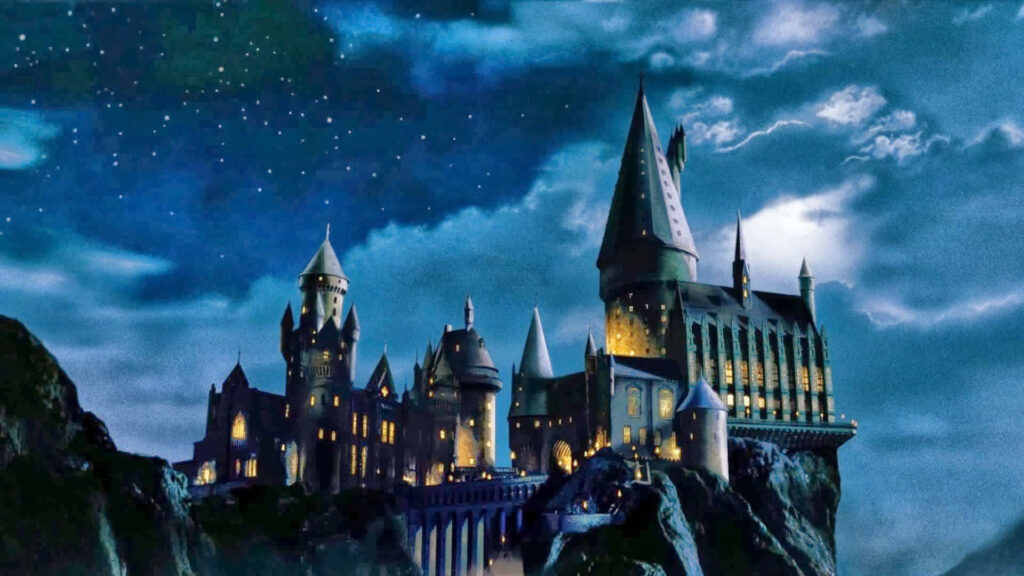 Magical Hogwarts Castle Wallpaper: Christmas Night Sky Background