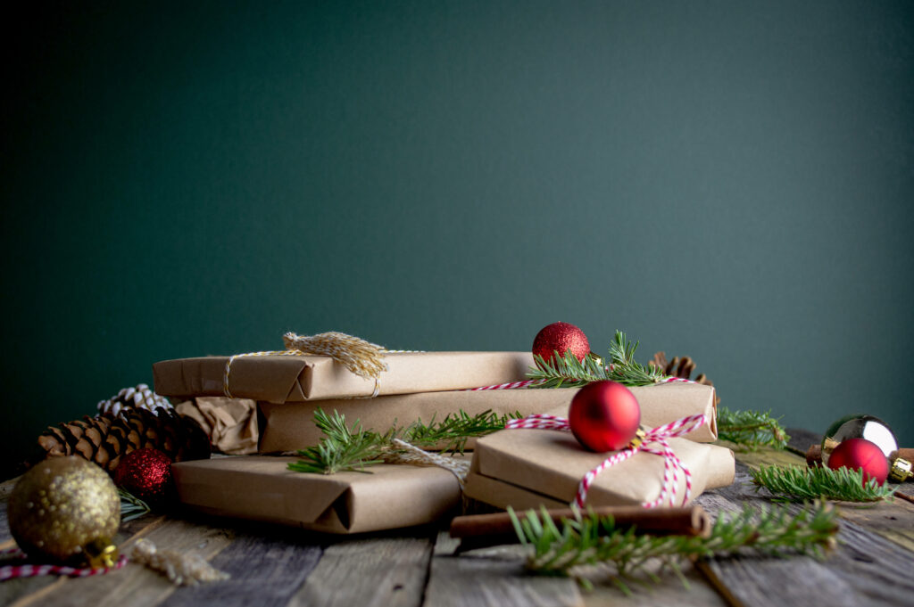 Festive Delights: Unwrapping the Magic of Christmas at Home with a Cascade of Beautiful Presents Under a Sparkling Tree Wallpaper