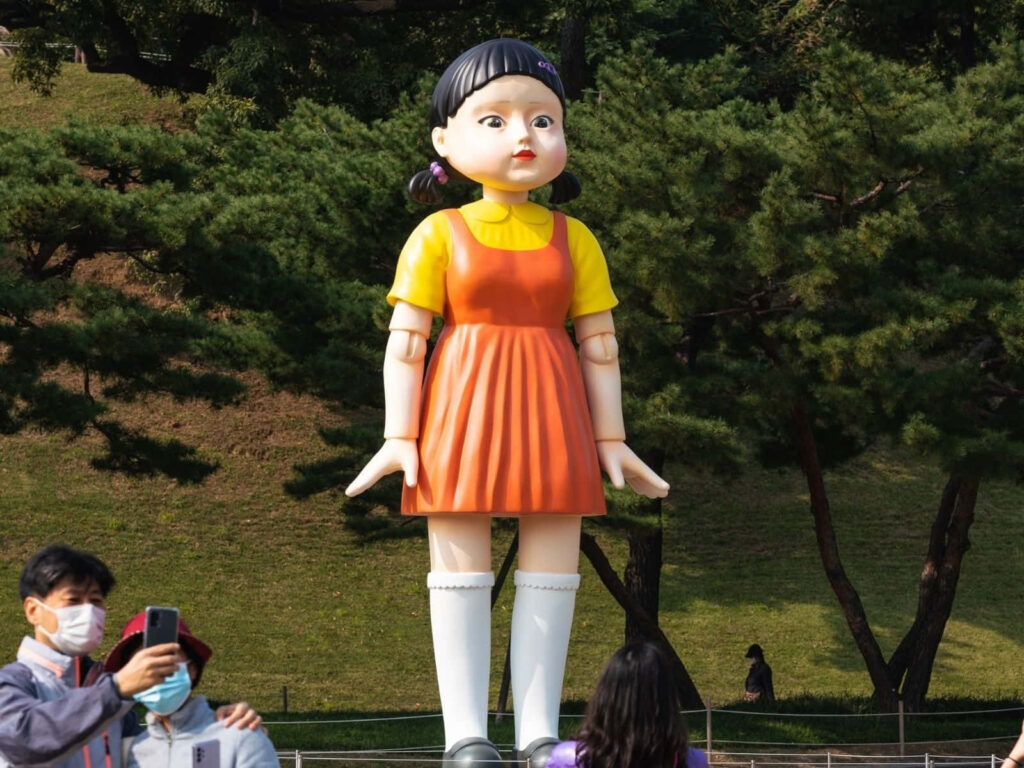 Young-hee Statue as the Captivating Matrix in the Squid Game Red Light, Green Light Wallpaper