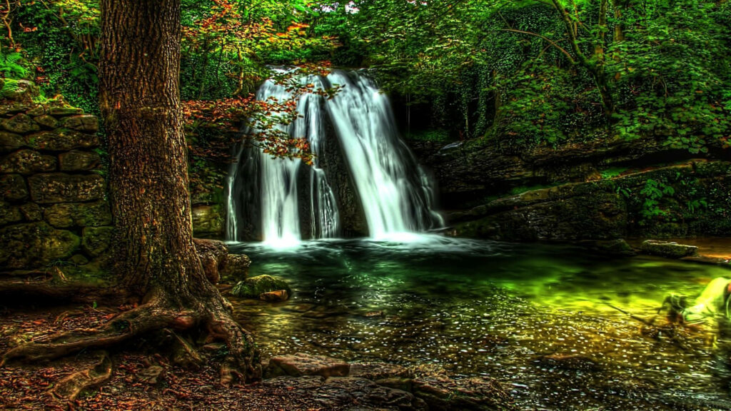 Enchanting Janet's Foss Waterfall Wallpaper – Lush Greenery & Tranquil Vibes