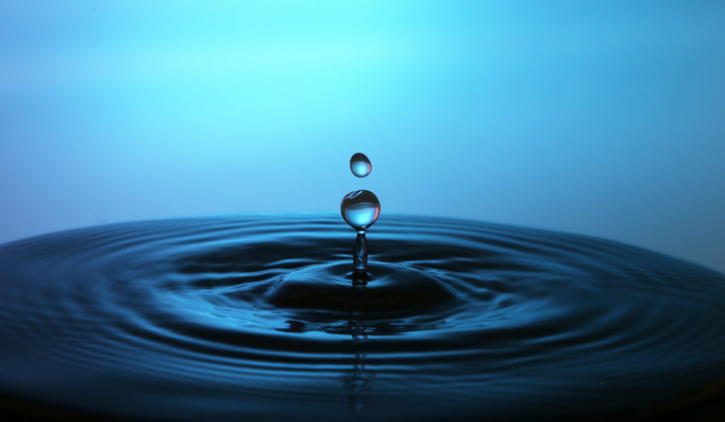 Captivating Aqua Embrace: Macro Closeup of Water Droplet in 4K Wallpapers