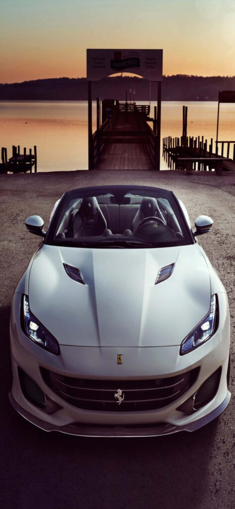Captivating Snapshot: A Deluxe Max Ferrari Setting Showcasing the Sleek Elegance of a Light Grey Ferrari Portofino Wallpaper