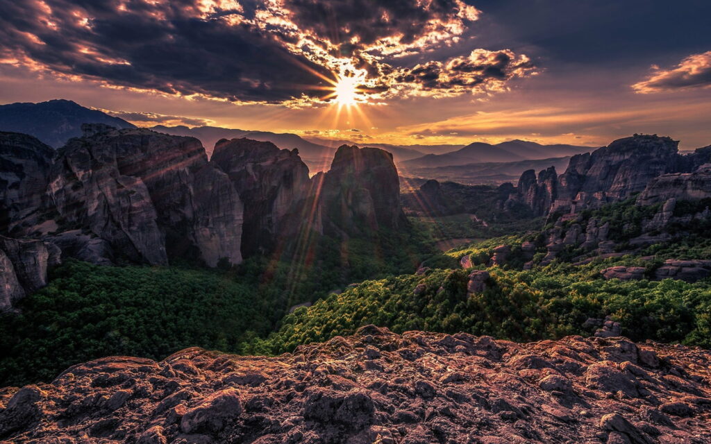 Majestic Beauty: A Captivating Sunset in Thessaly's Enchanting Meteora Mountain Valley Wallpaper