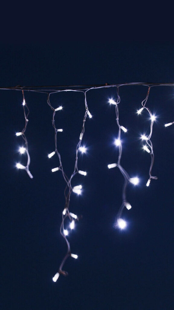 Minimalist Black Background with Elegant White LED String Lights Wallpaper