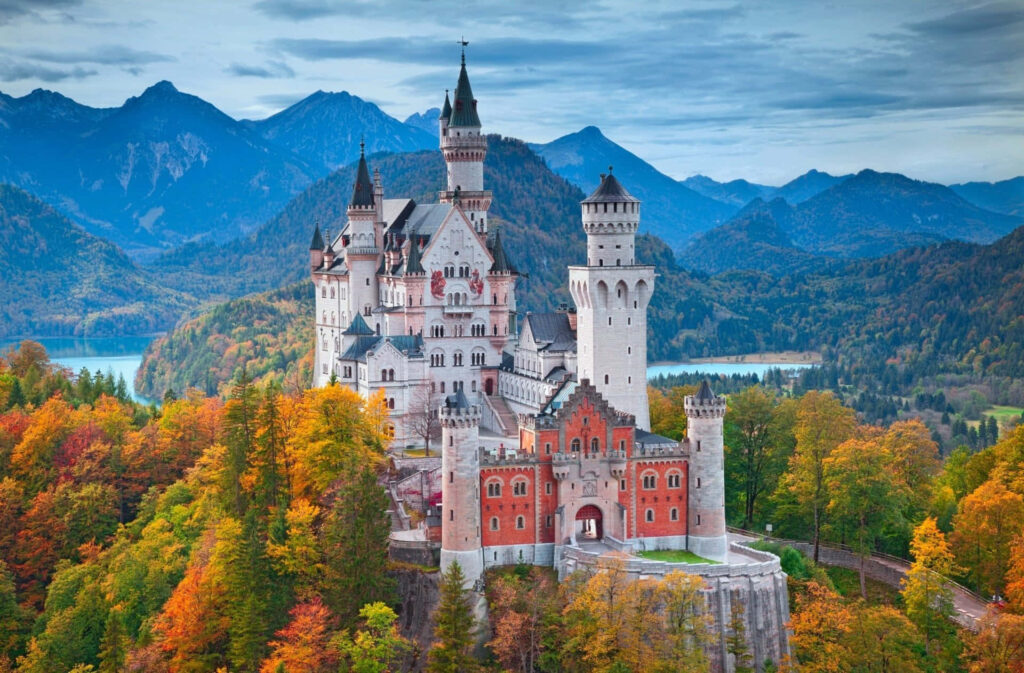 Enchanting Neuschwanstein Castle Wallpaper: Autumn Foliage & Mountains