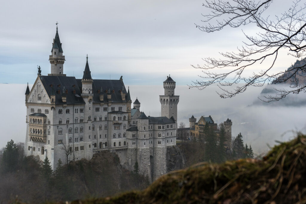 Enchanting Neuschwanstein Castle Foggy Wallpaper Background