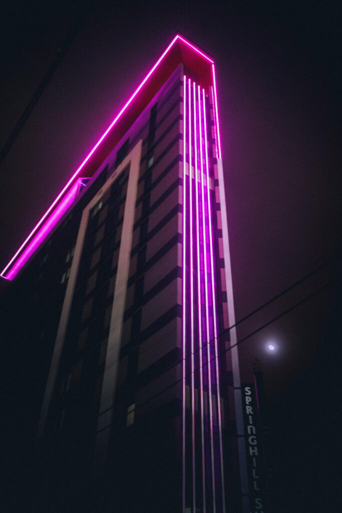 Neon Lights Amidst City Night's Purple Palette Wallpaper