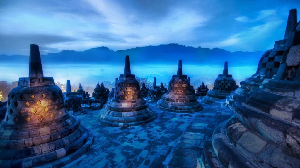 Enchanting Nighttime Stupa Wallpaper: Mystical Mountain View