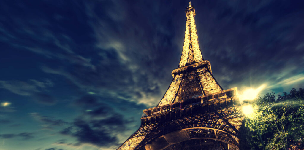 Nighttime Spectacle: Captivating Sky Scenery Surrounding the Eiffel Tower Wallpaper