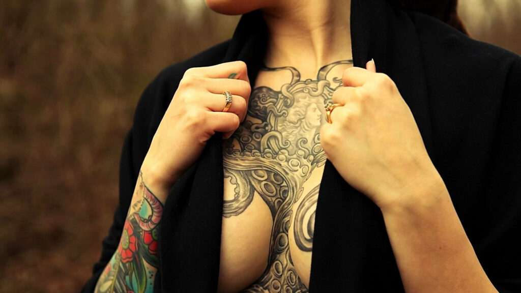 Inking the Abyss: A Captivating Octopus Chest Tattoo Wallpaper
