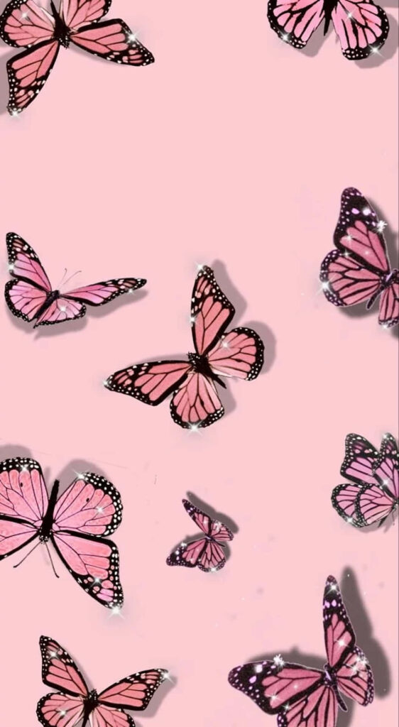 Delightful Pink Butterflies on Soft Pastel Wallpaper Background