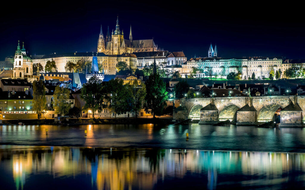 Enchanting Prague Castle Wallpaper: Night View & Vltava Reflection