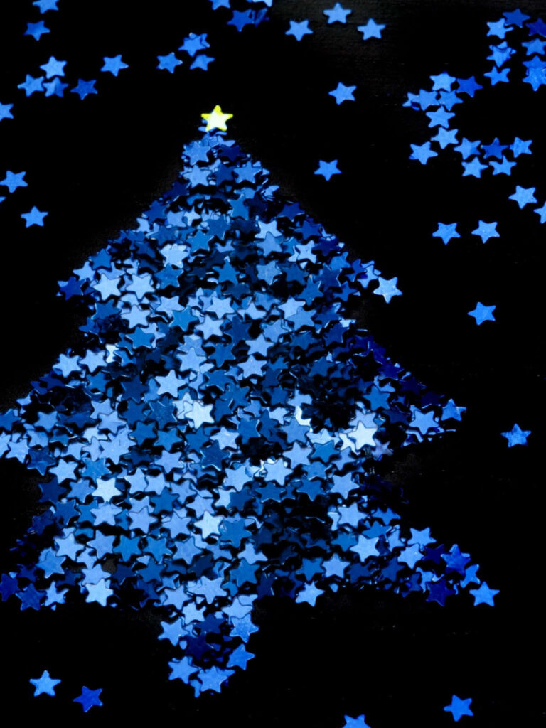 Enchanting Snow-Covered Tree Wallpaper with Shimmering Blue Stars