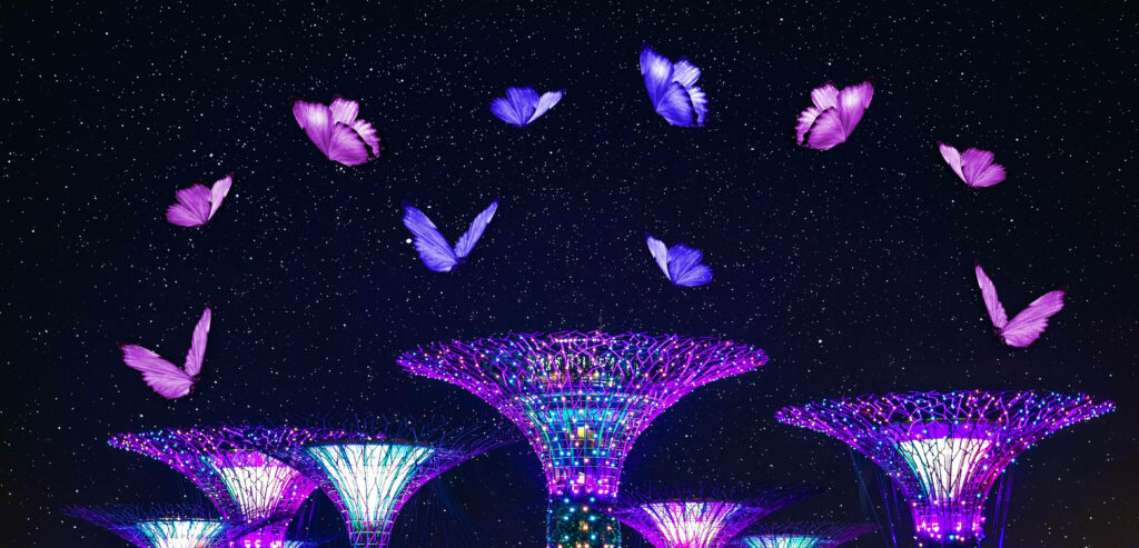 Nebulous Nocturnal Butterflies: Mesmerizing Wallpaper of Luminous Pink and Purple Butterflies Fluttering Amongst a Celestial Nightscape