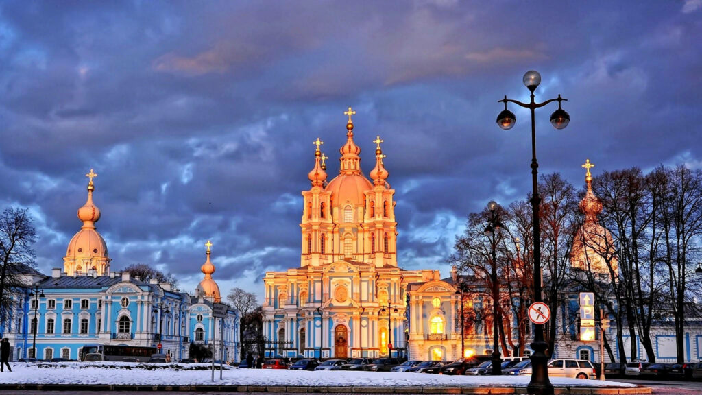 Majestic Winter Splendor: St. Petersburg's Ornate Cathedrals Amidst Snowy Delight Wallpaper
