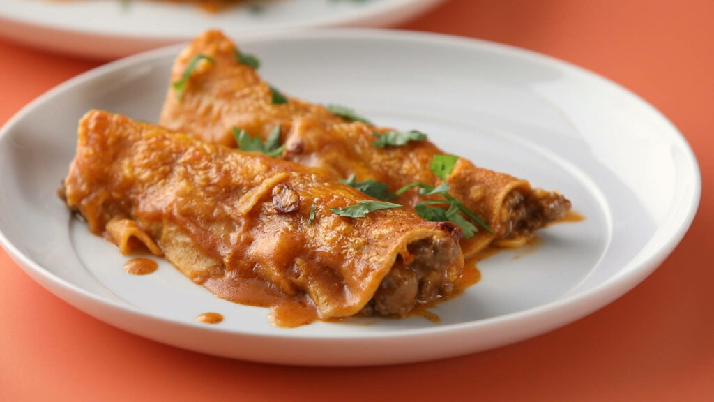 Delicious Enchilada Rolls Wallpaper: Melted Cheese & Fresh Cilantro
