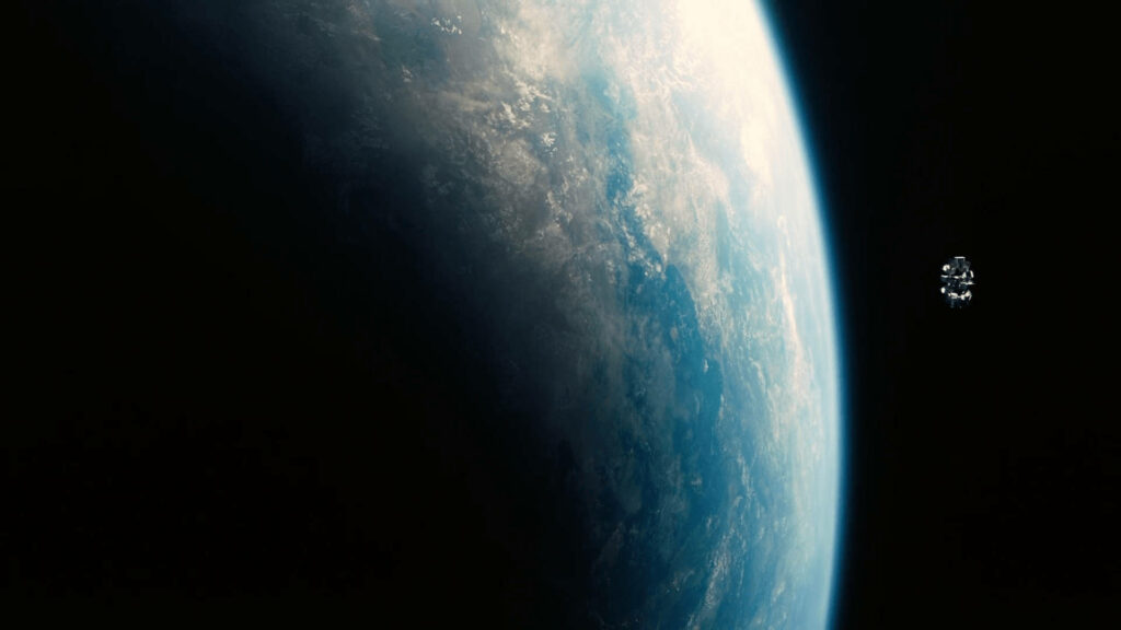 Endurance spacecraft from Interstellar floats above Earth curved horizon in vast space wallpaper
