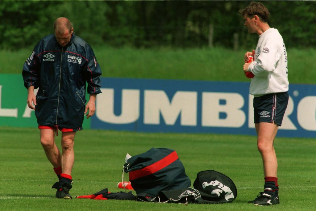 England football training session with manager Glenn Hoddle on pitch Umbro gear background Wallpaper