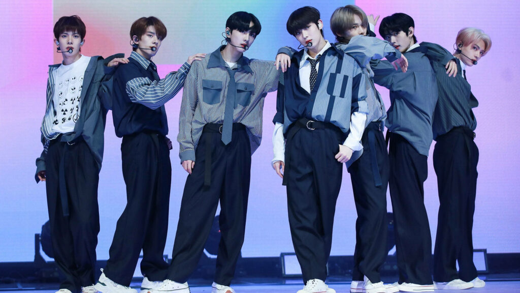Mesmerizing Stage Presence: Enhypen's Vibrant Performance Amidst Pastel LED Backdrop Wallpaper