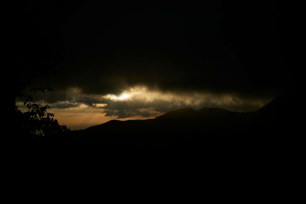 Eerie Sky Casts Silhouette Over Guadeloupe's Enigmatic Landscape Wallpaper
