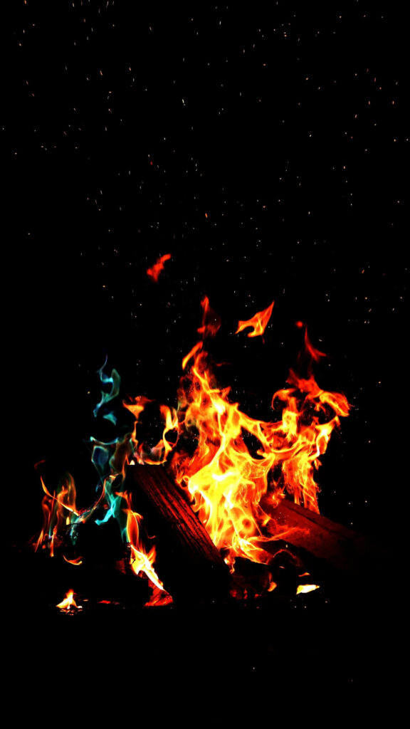 Glowing Embers in the Midnight Flames: A Captivating 4K Phone Wallpaper