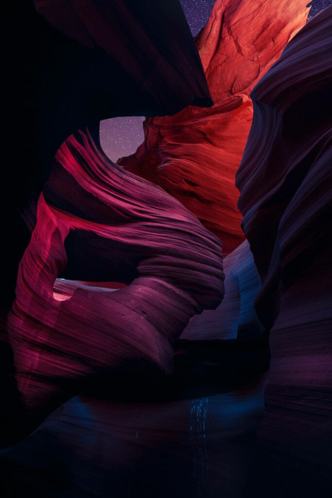 Mystical Rock Formations Captured in Dynamic Lighting - IPhone 12 Pro Wallpaper