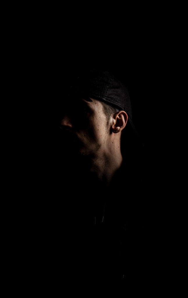 Mysterious Profile Silhouette on a Dark Background Wallpaper