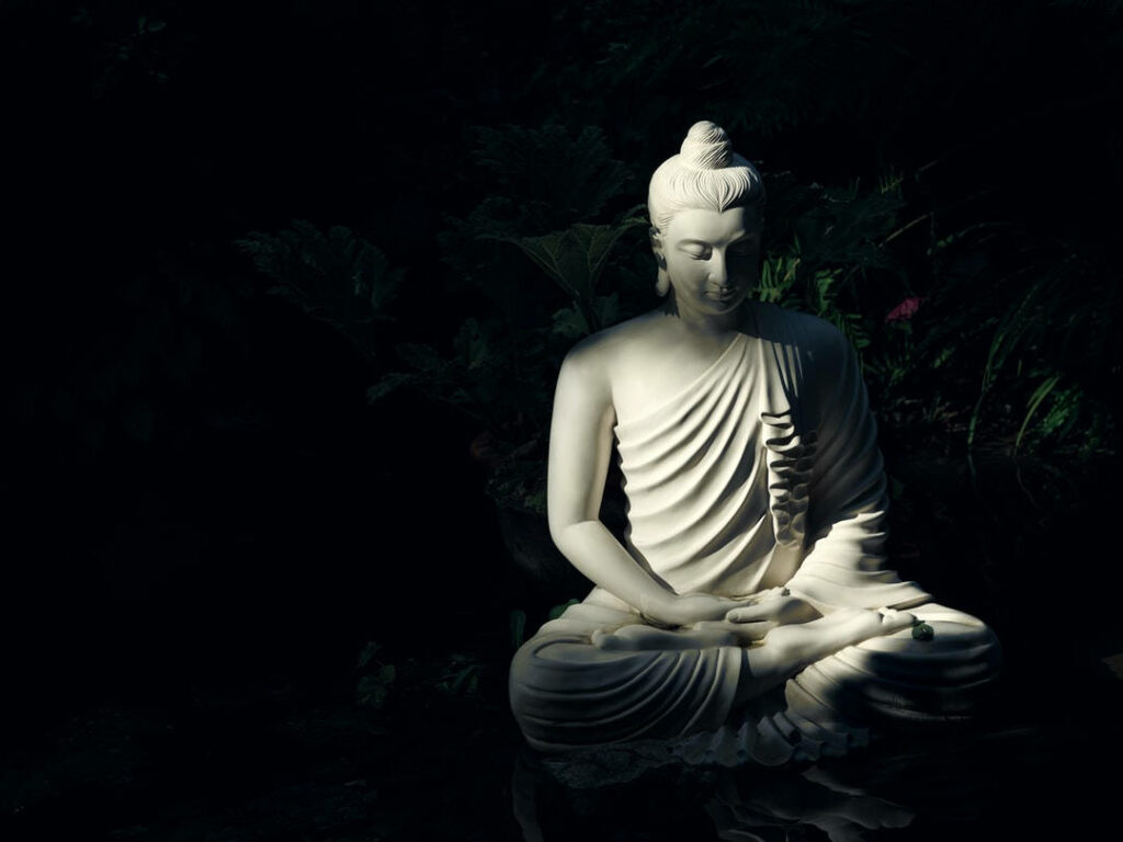 Enchanting Stillness: Illuminated Buddha Statue in Mesmerizing 3D Ambience Wallpaper