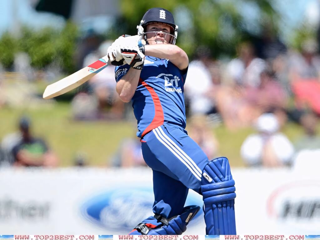 Eoin Morgan in England blue kit powerfully striking cricket ball in dynamic sports wallpaper