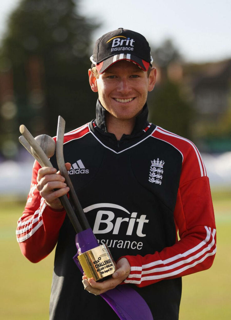 Eoin Morgan England cricket portrait holding trophy smiling vibrant sports photography wallpaper
